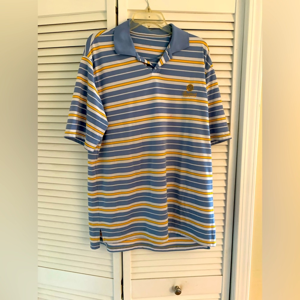 Man’s blue and white, striped polo by Under Armour.